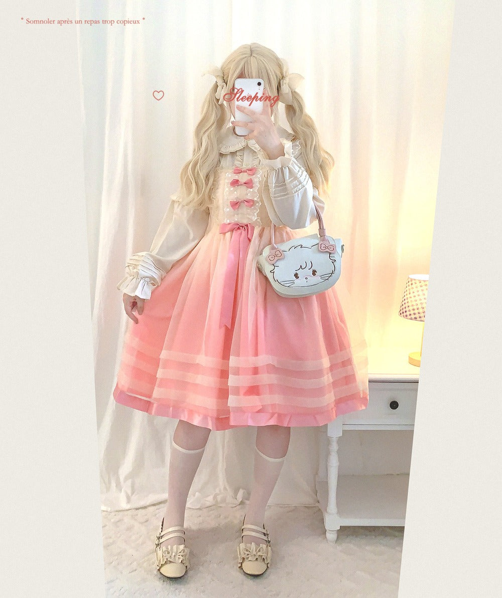 Person wearing a pink and white outfit with a matching handbag, standing in a softly lit room.