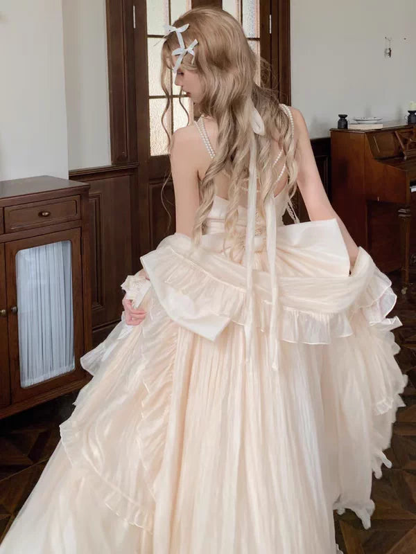 Woman in a white wedding dress with long hair in a room.