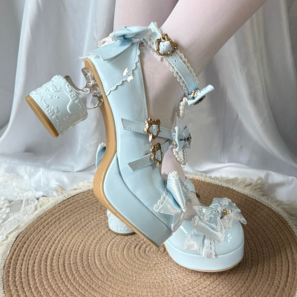 Light blue high-heeled shoes with decorative elements on a white background