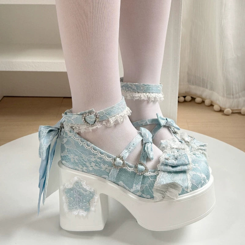 Light blue lace platform shoes with white soles worn by a person.