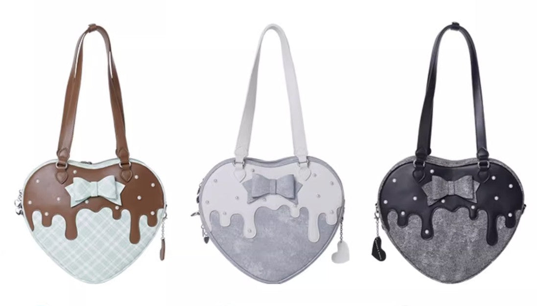 Three heart-shaped bags with different color schemes and designs on a white background