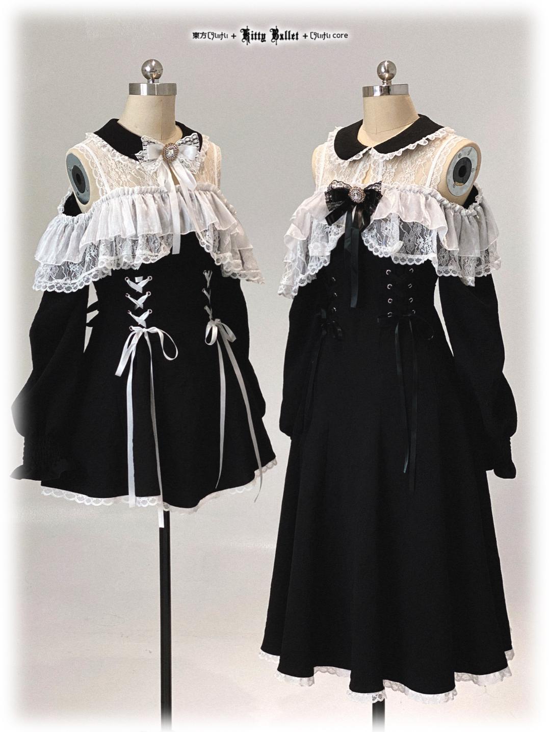 Two jirai kei styles black dresses with white lace details on mannequins against a white background.