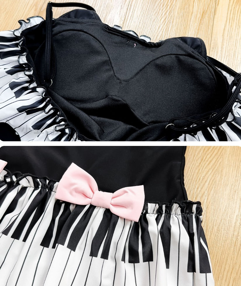 Black top with a zebra-striped skirt and pink bow on a wooden surface