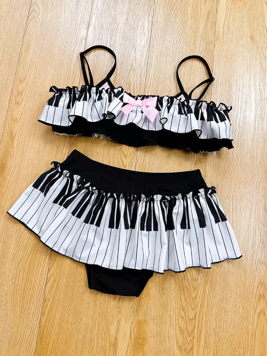Black and white striped bikini set on a wooden floor