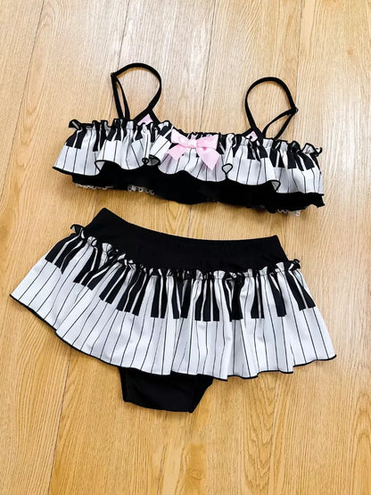 Black and white striped bikini set on a wooden floor