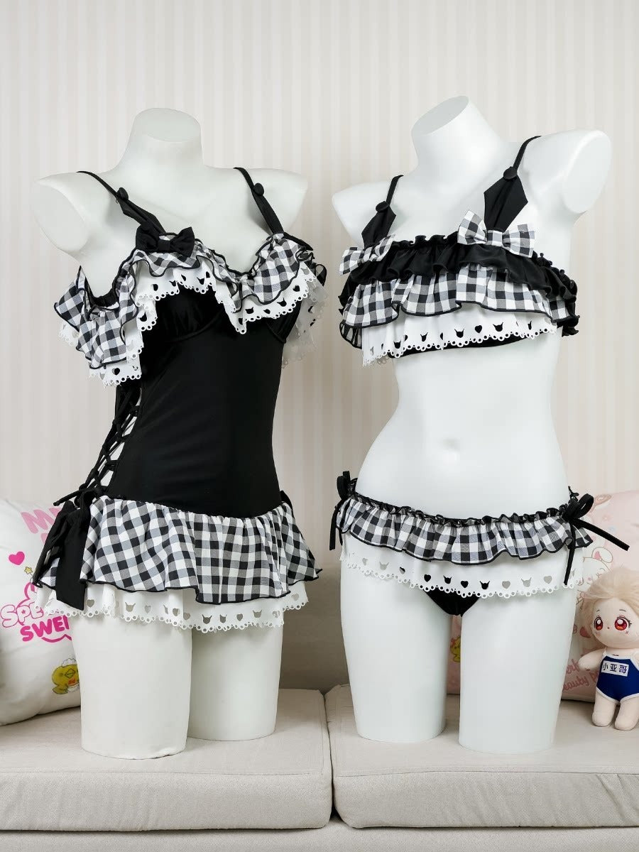Black and white checkered lingerie set on mannequins against a neutral background