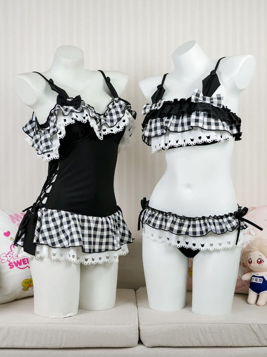 Black and white checkered lingerie set on mannequins against a neutral background
