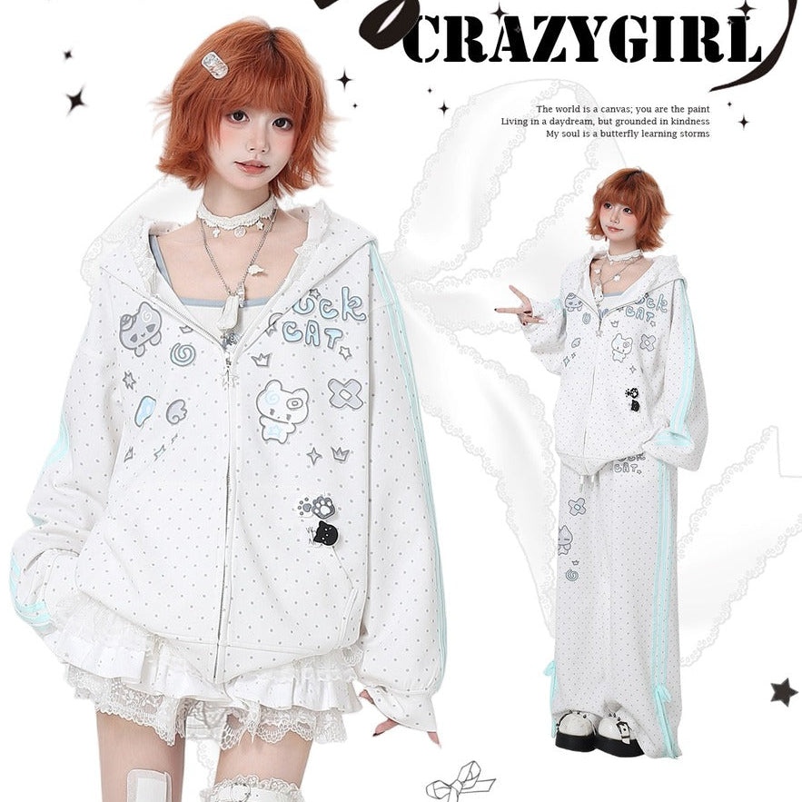 Person wearing a white outfit with cartoon character designs, standing against a white background