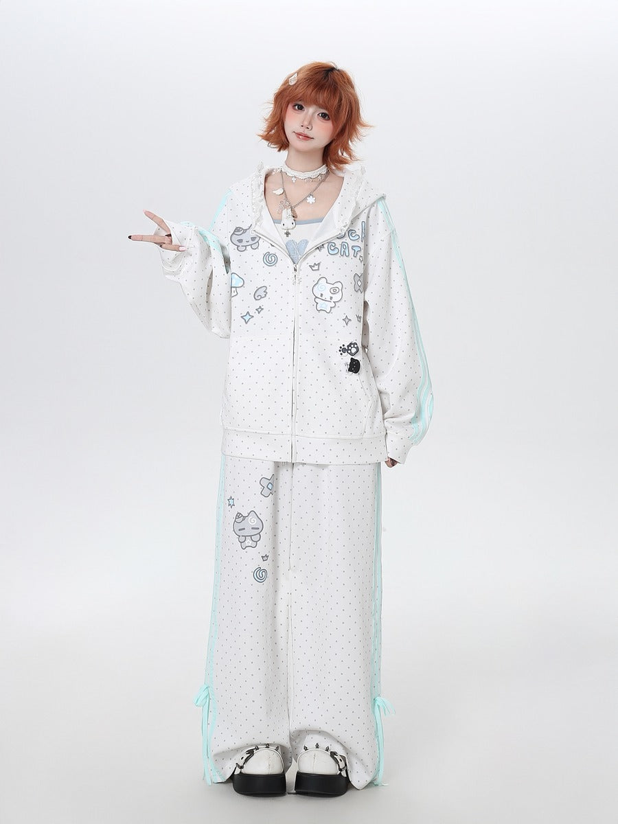 Person wearing a white outfit with cartoon designs on a plain background