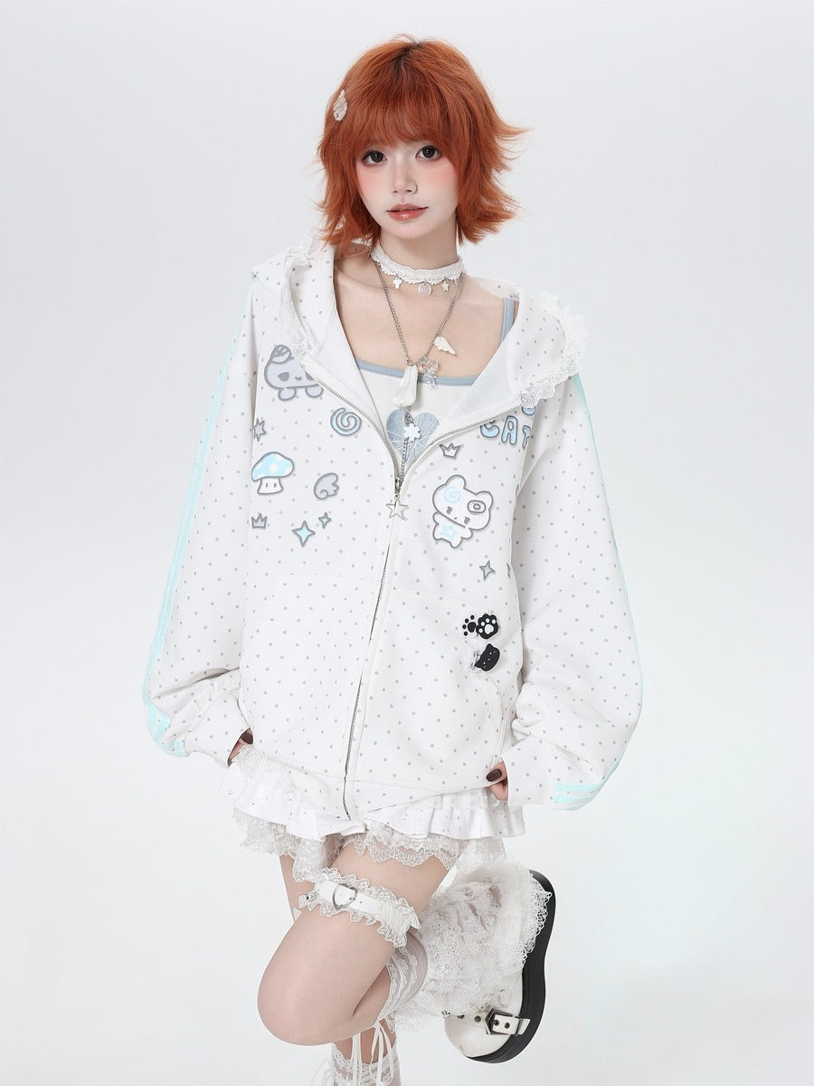 Person wearing a white hoodie with cartoon designs on a white background