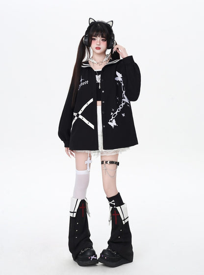 Person wearing a black outfit with white accents on a white background