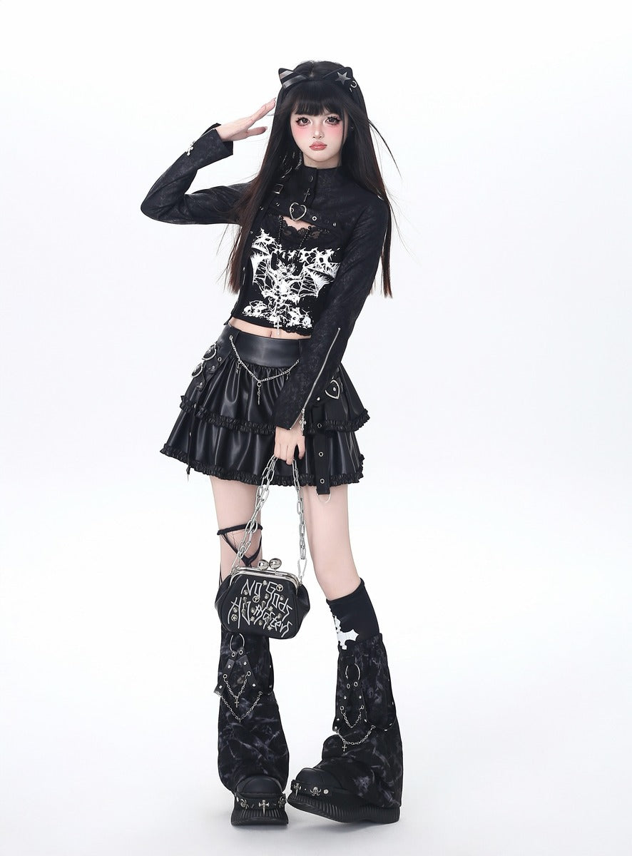 Person wearing a black and white outfit with cat ears on a white background