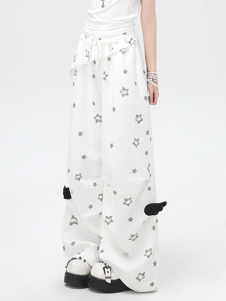 White pants with star pattern worn by a person on a white background