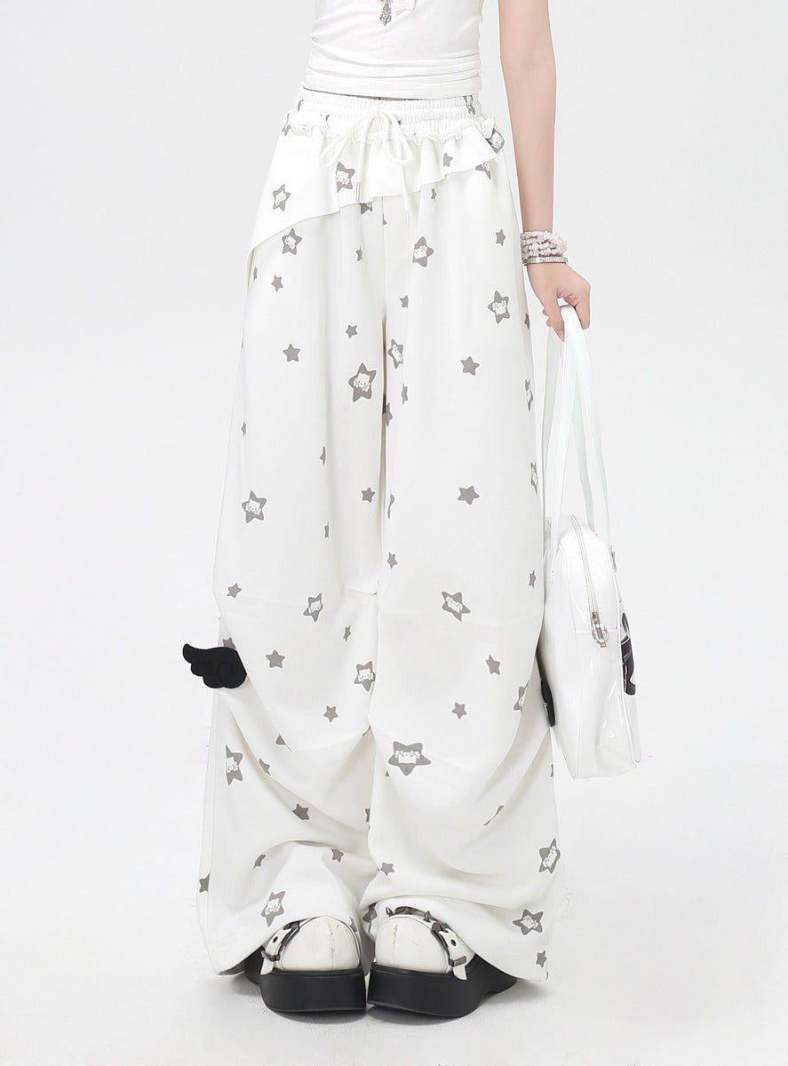 White pants with star patterns and black accents on a white background