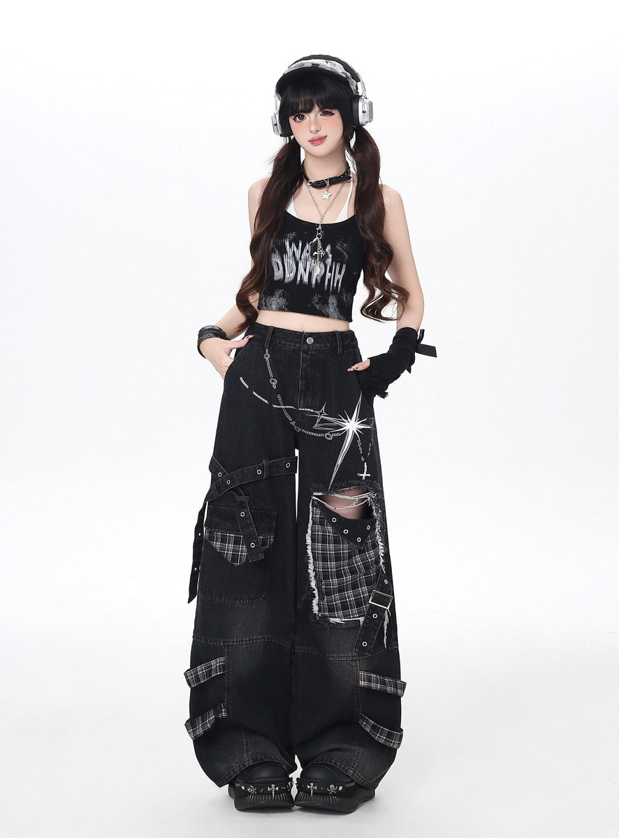 Person wearing a black outfit with plaid accents and headphones on a white background