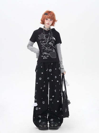 Person wearing a black outfit with star patterns on a white background