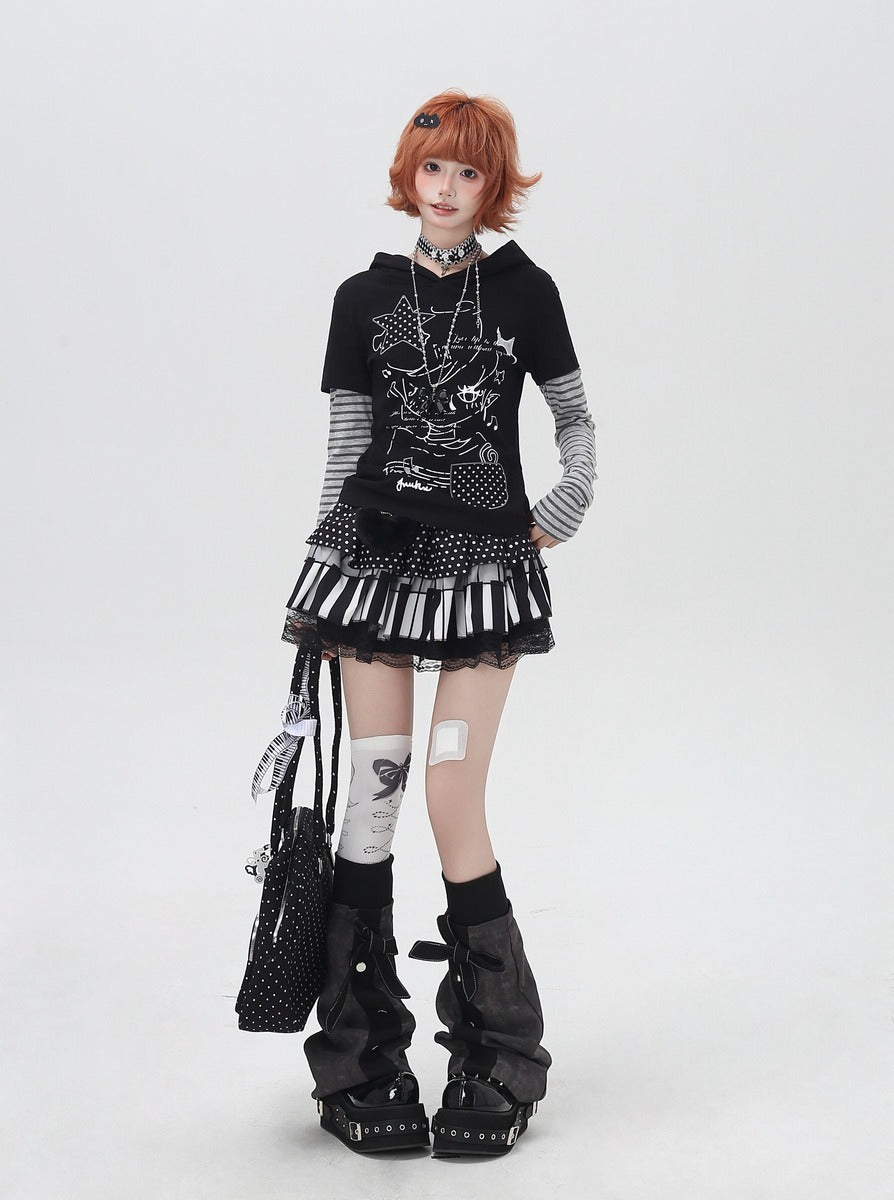 Person wearing a black and white outfit with a keyboard skirt on a white background