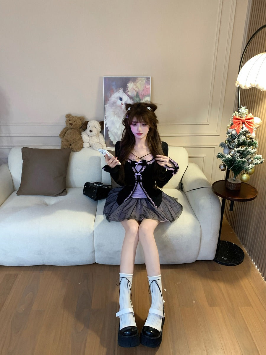 Woman sitting on a couch in a stylish outfit with decorative items in the background