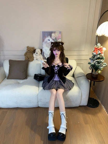 Woman sitting on a couch in a stylish outfit with decorative items in the background