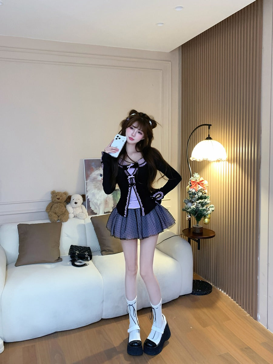 Woman taking a selfie in a stylish outfit in a living room.