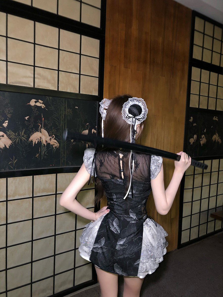 Person in a maid outfit holding a black belt against a decorative wall.