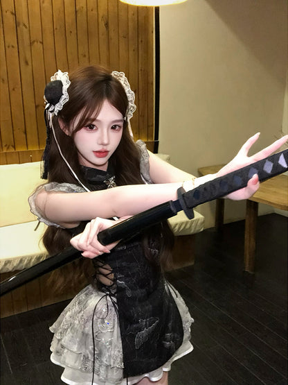 Person in a maid outfit holding a samurai sword indoors.