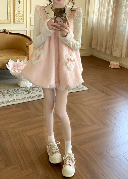 Person wearing a pink dress with white shoes in a room with wooden floor and decorative elements.