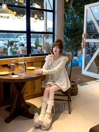 Woman sitting at a table in a modern cafe with large windows.