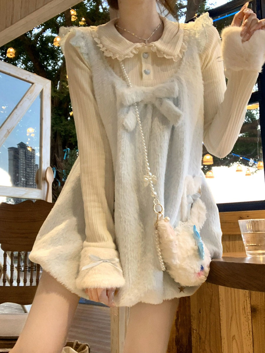 Person wearing a light-colored outfit with a fluffy accessory, sitting at an outdoor cafe.