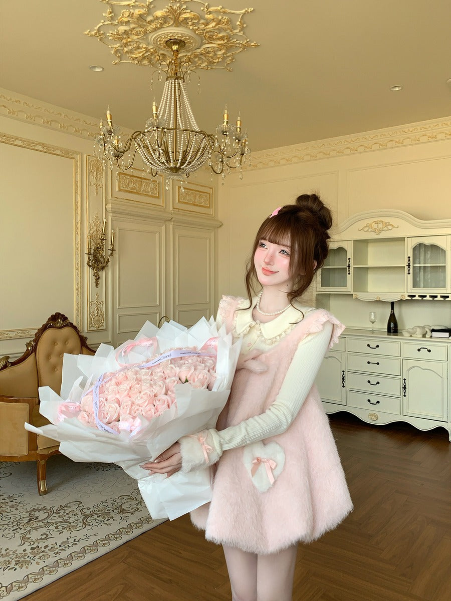 Woman holding a bouquet of pink flowers in an elegant room with chandelier and furniture.