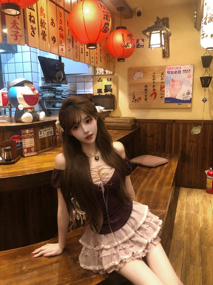 Woman sitting at a wooden table in a restaurant with red lanterns and Japanese text on the wall.