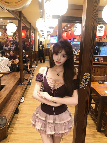 Woman in a restaurant setting with wooden interior and hanging lights