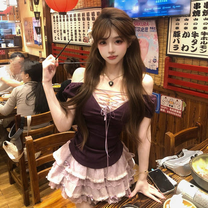 Woman in a restaurant setting with a TV screen in the background