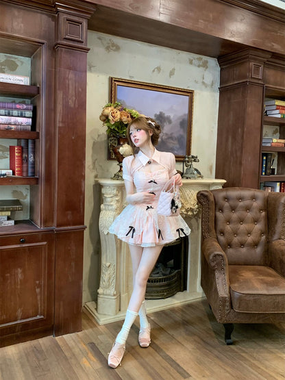 Woman in a stylish outfit standing in an elegant room with wooden furniture and a fireplace.