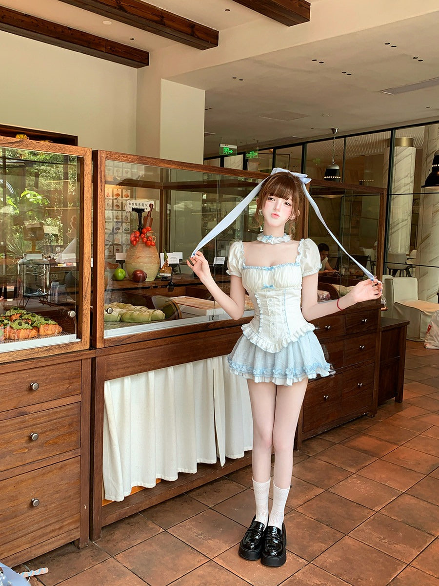 Person in a maid outfit standing in a restaurant kitchen