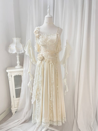 Elegant lace dress on a mannequin against a white curtain backdrop