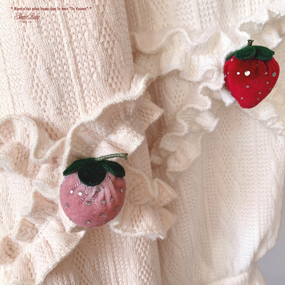 Strawberry-shaped on a textured white fabric background