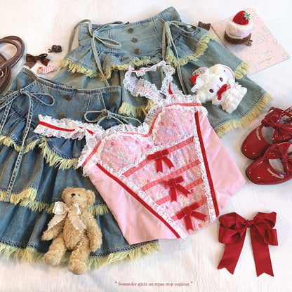 Women clothing and accessories including a denim dress, pink dress with red ribbons, teddy bear, and shoes on a white background.