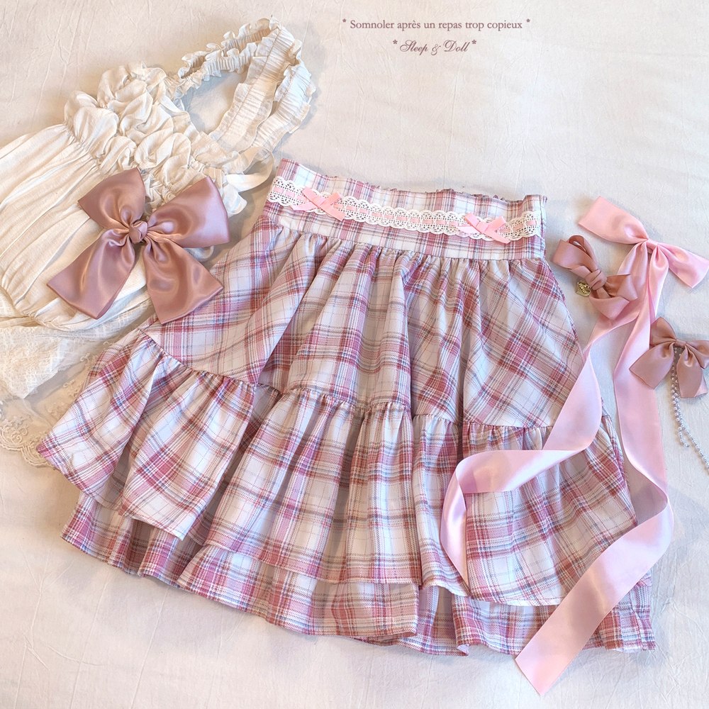 Plaid skirt with ribbons and a bow on a light background