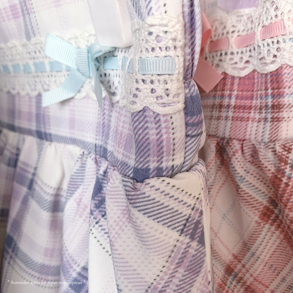 Plaid patterned fabric with decorative bows and ribbons.