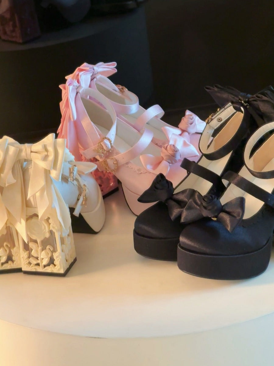 Three pairs of platform shoes in different colors on a surface.