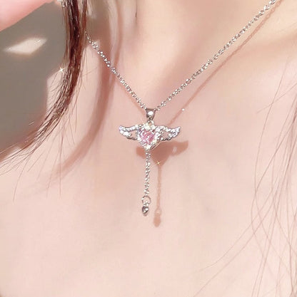 Necklace with a heart-shaped pendant worn by a person