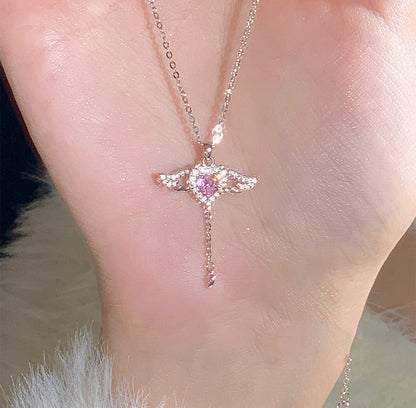 Necklace with a pink gemstone pendant on a person's neck