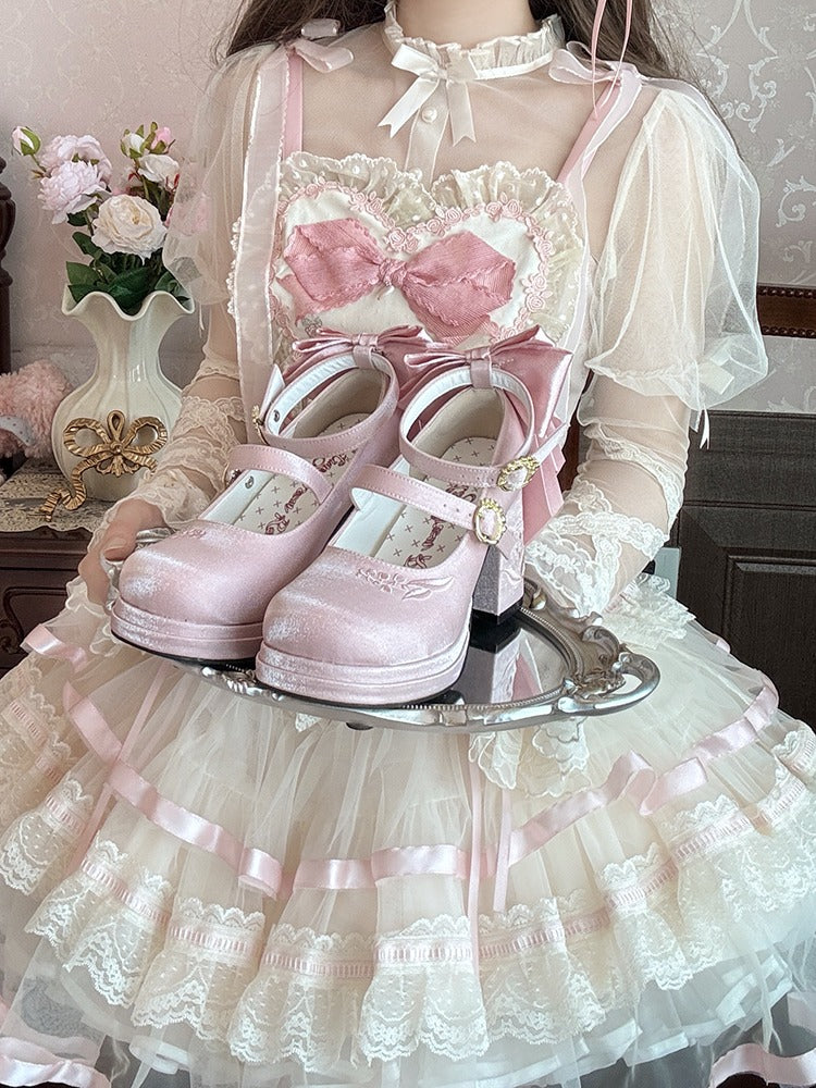 Lolita fashion outfit with pink shoes on a tray, lace dress, and floral decorations.