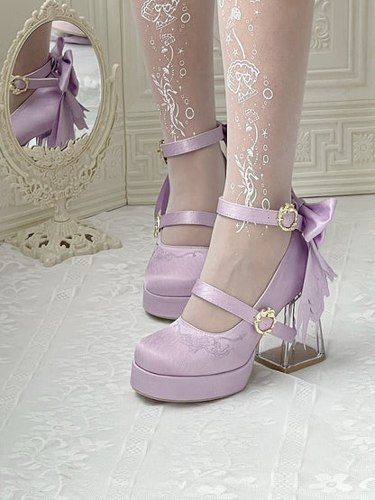 Purple platform shoes with decorative bows worn with sheer white tights featuring floral patterns.
