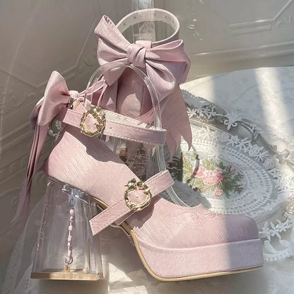 Pink high-heeled shoes with bows on a floral doily