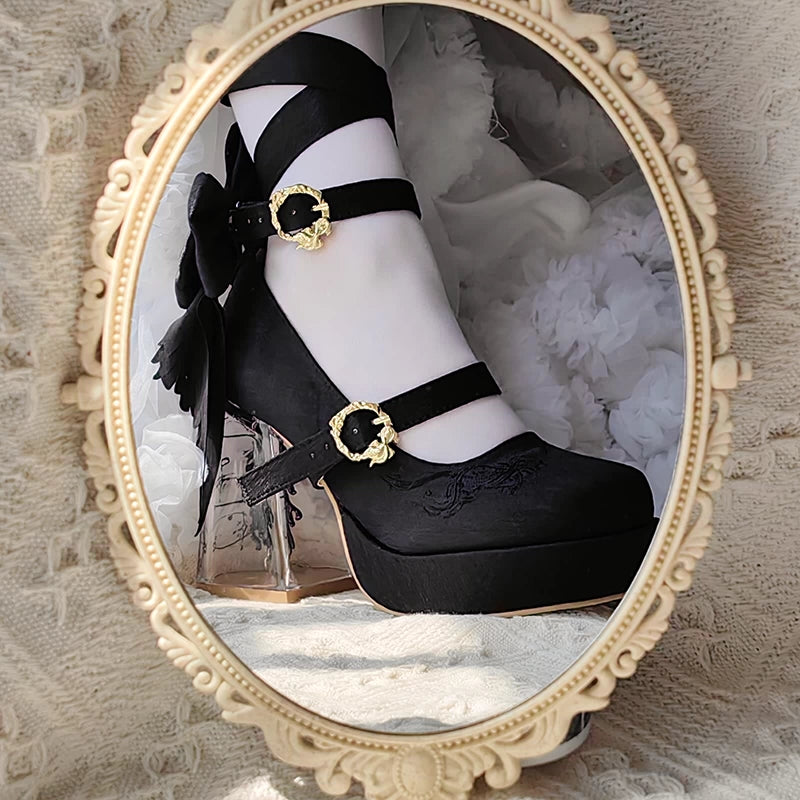 Black platform shoe with gold buckle and white socks in a decorative mirror frame.