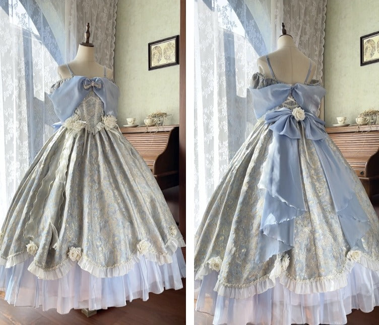 A light blue and silver Lolita-style ball gown displayed on a dress form, shown in a split-screen view from the front and back. The dress features a voluminous silver patterned skirt with a light blue off-the-shoulder bodice, a large bow at the back, and white floral accents.