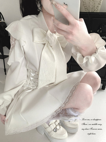 A person takes a mirror selfie wearing a cream-colored Lolita-style dress with a large bow, lace details, and ruffled sleeves, paired with white platform shoes.