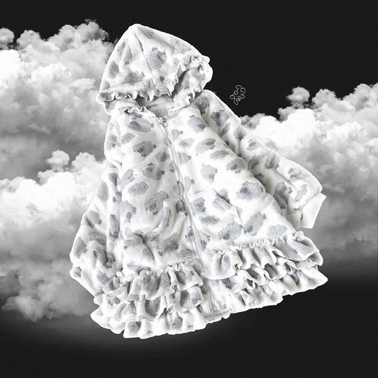 Sheep print baby blanket with ruffles on a cloud background